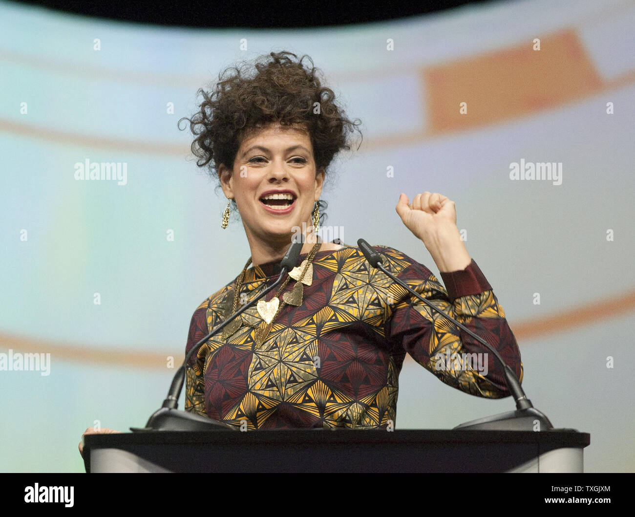 Band member Regine Chassagne speaks after receiving the Allan Waters