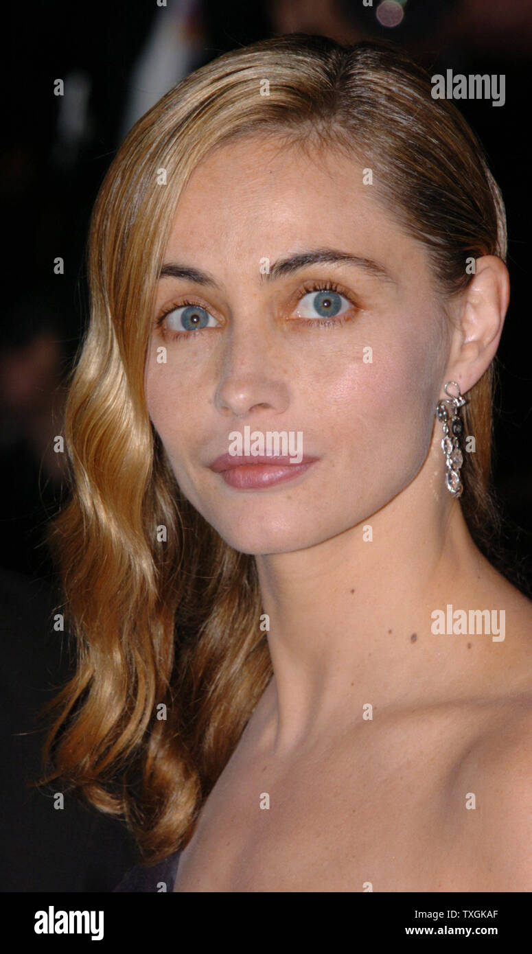 French actress Emmanuelle Beart poses for photographers on the red