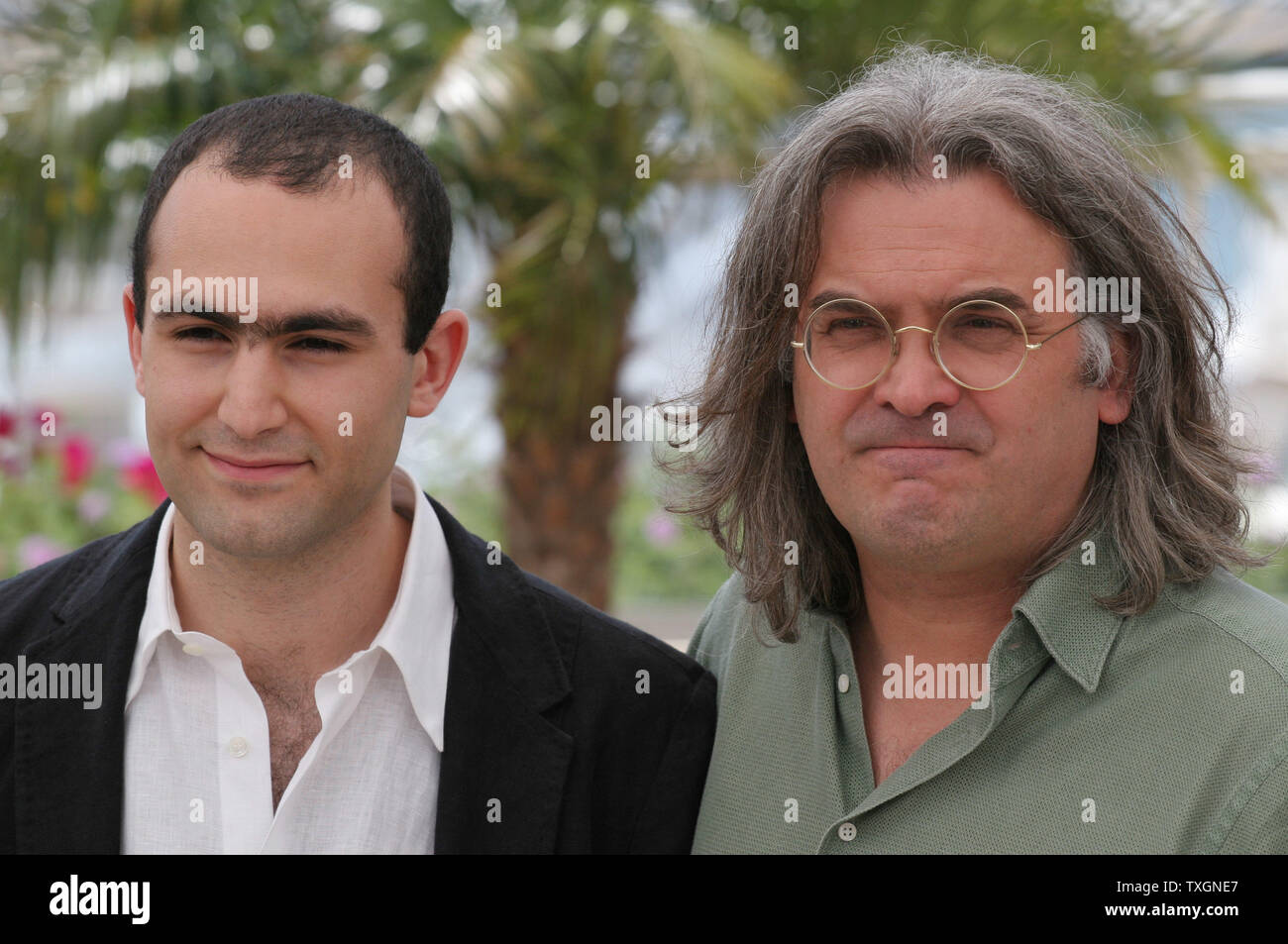 Actor Khalid Abdalla (L) and director Paul Greengrass arrive at a photo call for their film 'United 93' at the 59th Annual Cannes Film Festival in Cannes, France on May 26, 2006.           (UPI Photo/David Silpa) Stock Photo