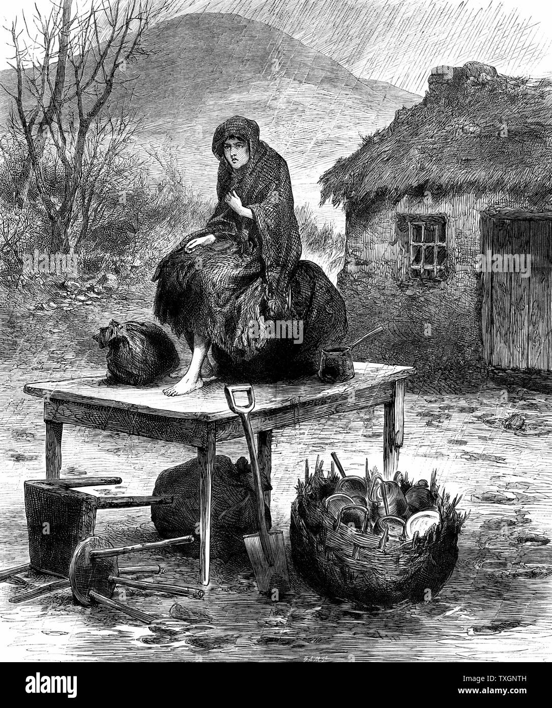 Potato Famine: Irish peasant girl guarding the family's last few  possessions after eviction for non-payment of rent. From 'The Illustrated London News', April 1886  Wood engraving Stock Photo