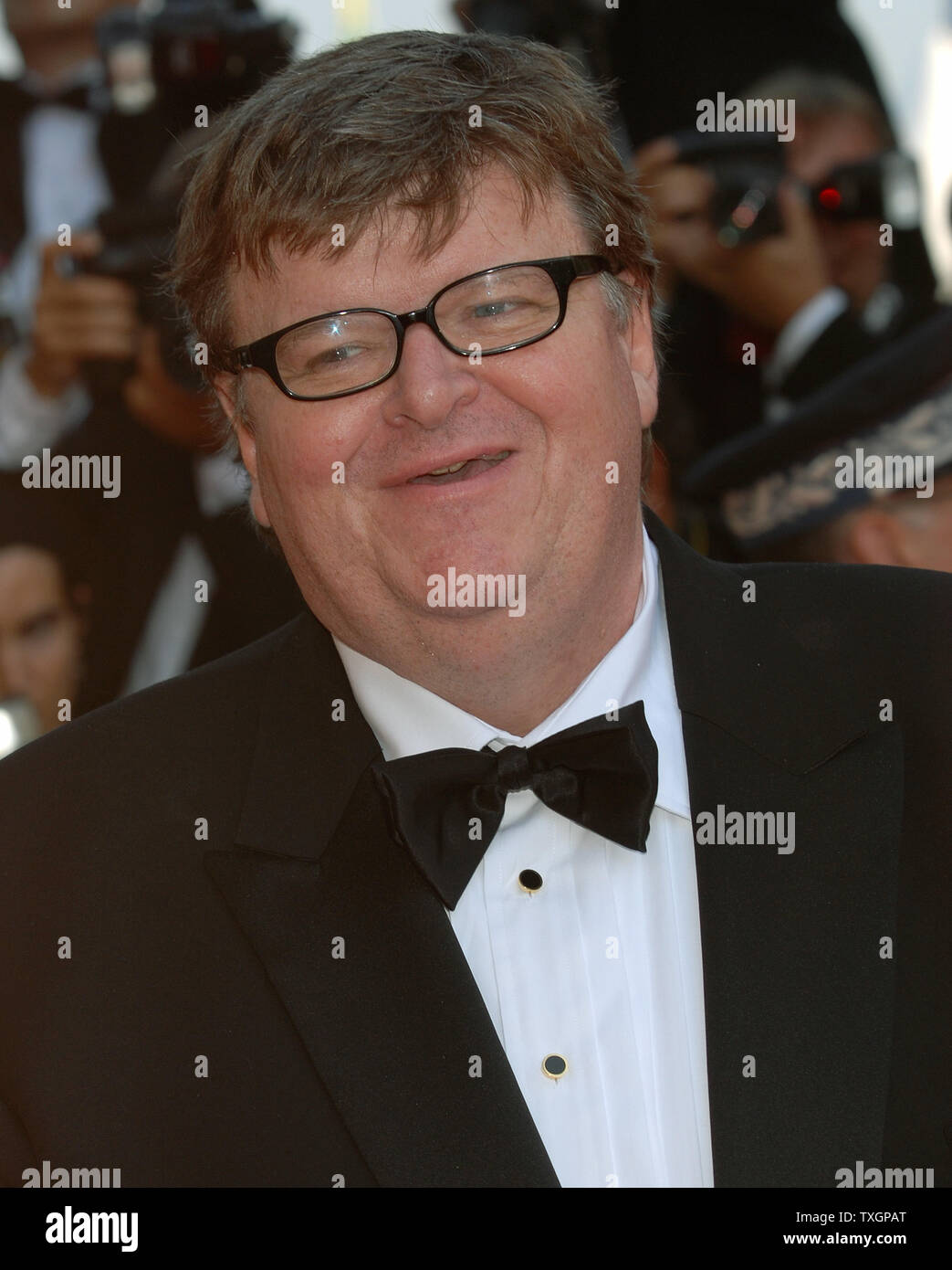 Director Michael Moore arrives at the Palais des Festivals for the gala ...