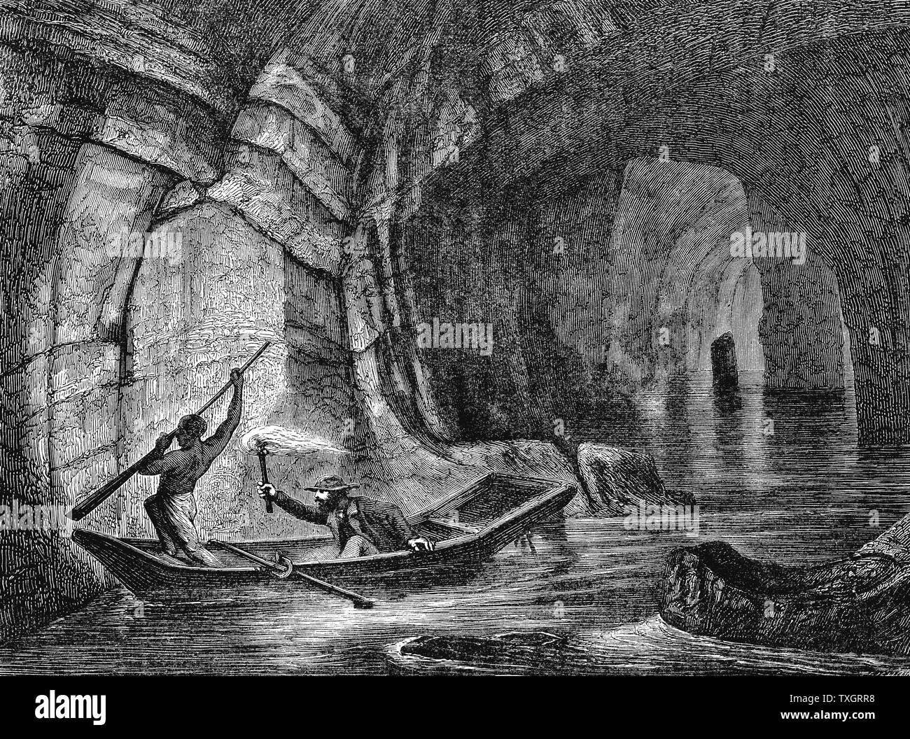 Exploring The Styx, a subterranean river in the Mammoth Cave, the system of limestone caverns in Kentucky c1870 Wood engraving USA Stock Photo