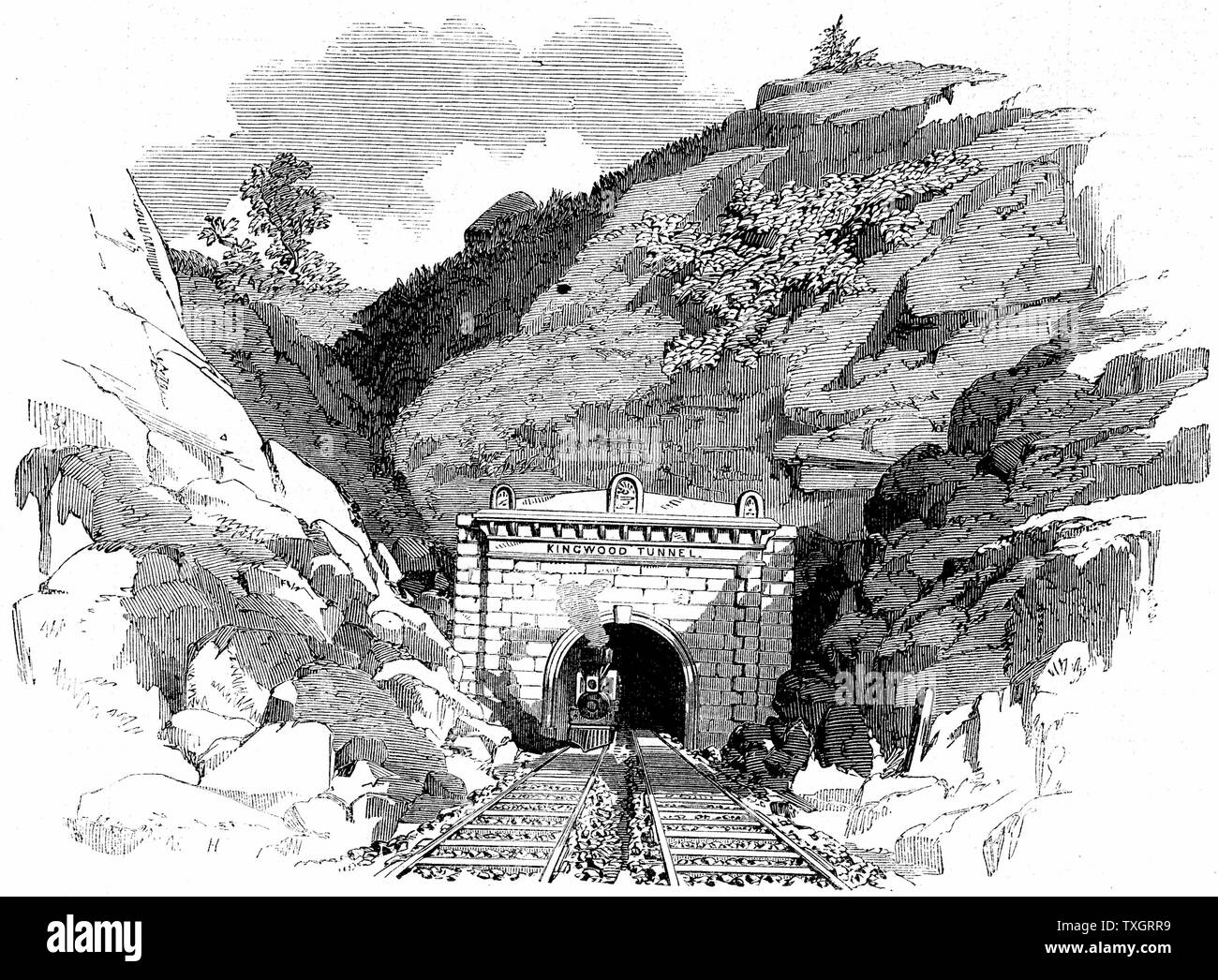 Baltimore and Ohio Railroad: Locomotive emerging from the 4100 ft Kingwood Tunnel through the Alleghany Mountains. From 'The Illustrated London News', May 1861. Wood engraving. Stock Photo