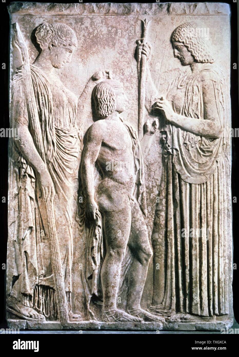 Demeter Greek goddess of corn and harvest equivalent to Ceres in Roman pantheon. Here presenting corn to Triptolemus. In Greek mythology Triptolemus, her and demi-god was taught arts of agriculture by the goddess Carved relief Stock Photo