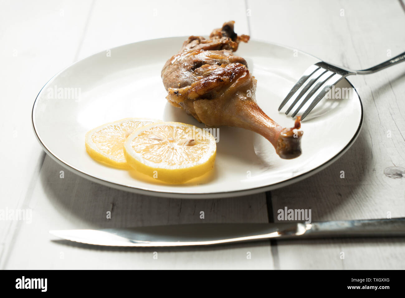 Roast duck leg with light color background Stock Photo - Alamy