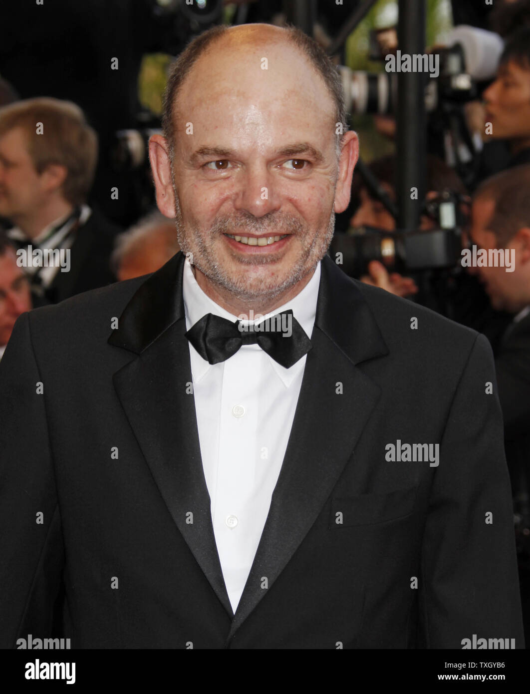 Actor Jean-Pierre Darroussin arrives on the red carpet before a screening of the film 'Up' at the opening of the 62nd annual Cannes Film Festival in Cannes, France on May 13, 2009.   (UPI Photo/David Silpa) Stock Photo