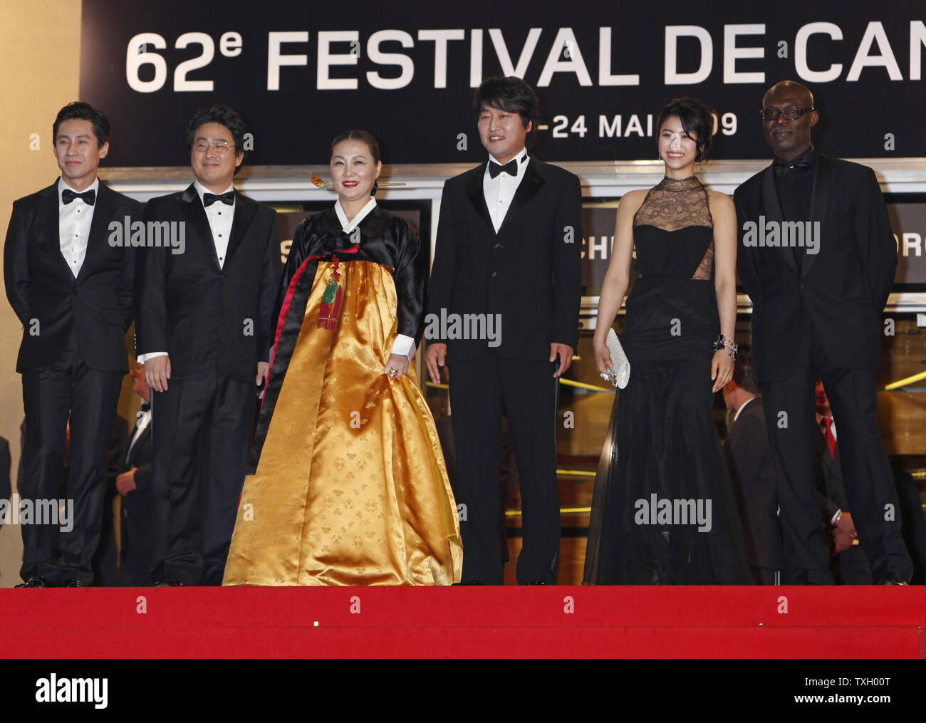 (From L to R) Director Chan-Wook Park, actors Kim Ok-Vin, Kim Hae-Sook, Shin Ha-Kyun, Song Kang-Ho and Eriq Ebouaney arrive at the top of the red steps before a screening of the film 'Thirst' at the 62nd annual Cannes Film Festival in Cannes, France on May 15, 2009.   (UPI Photo/David Silpa) Stock Photo