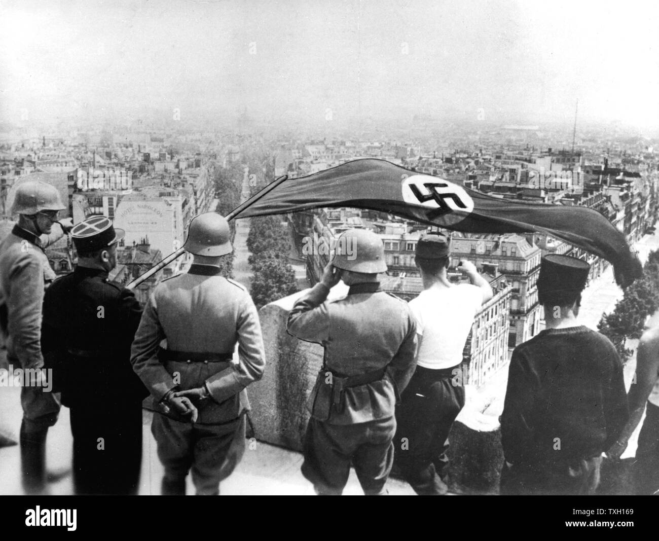 World War 2:German occupation of Paris, June 1940.  The German flag flying from the Arc de Triomphe Stock Photo
