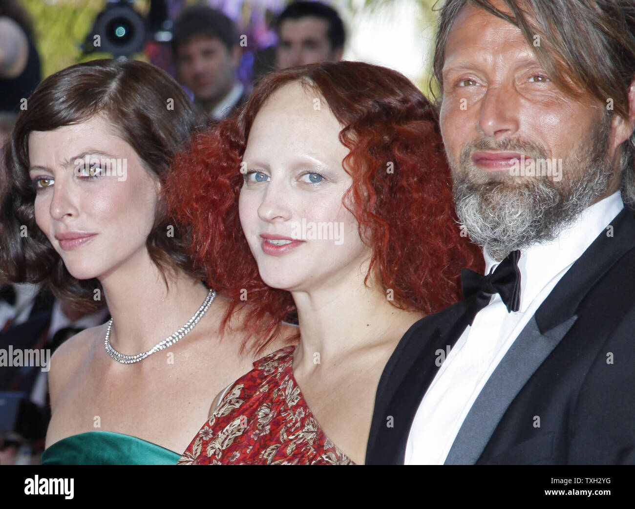 Actresses Anna Mouglalis (L), Elena Morozova (C) and actor Mads Mikkelsen arrive on the red carpet before the premiere of the film 'Coco Chanel & Igor Stravinsky' during the closing ceremony of the 62nd annual Cannes Film Festival in Cannes, France on May 24, 2009.   (UPI Photo/David Silpa) Stock Photo