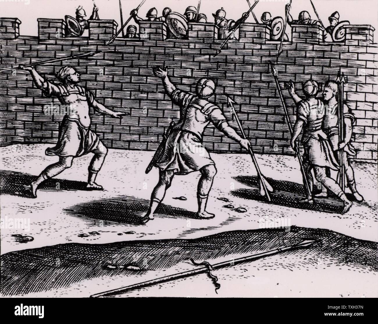 Roman spearmen attacking the walls of a besieged fortress.   From 'Poliorceticon sive de machinis tormentis telis' by Justus Lipsius (Joost Lips) (Antwerp, 1605). Engraving. Stock Photo