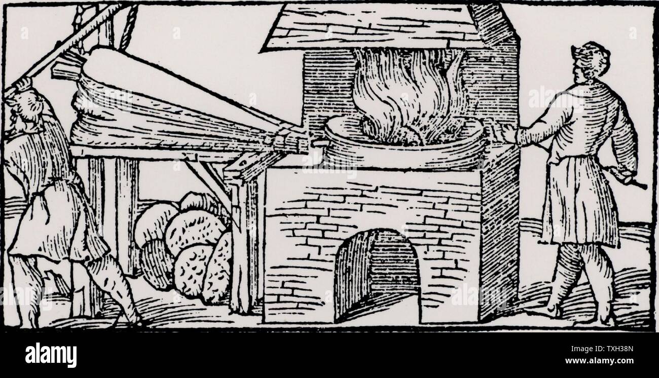 Using bellows to increase the draught in a furnace for refining copper.  From 'De la pirotechnia' by Vannoccio Biriguccio (Venice, 1540). Stock Photo