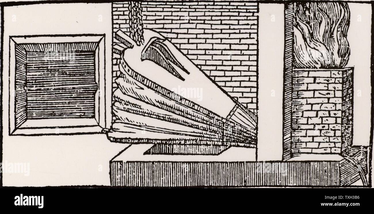 Smelting iron ore in a blast furnace.  From 'De la pirotechnia' by Vannoccio Biringuccio (Venice, 1540). Stock Photo