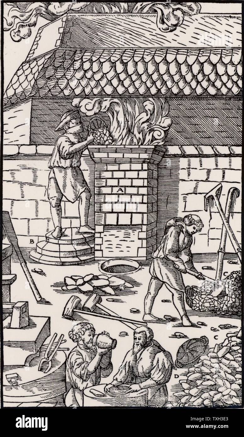 Blast furnace for smelting iron ore.   From 'De re metallica', by Agricola, pseudonym of Georg Bauer (Basle, 1556).   Woodcut. Stock Photo