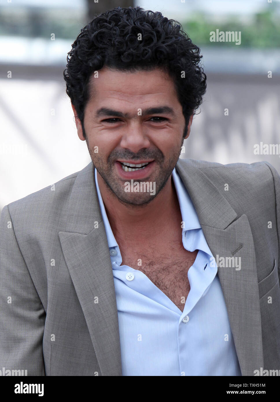 Jamel Debbouze arrives at a photocall for the film “Hors La Loi