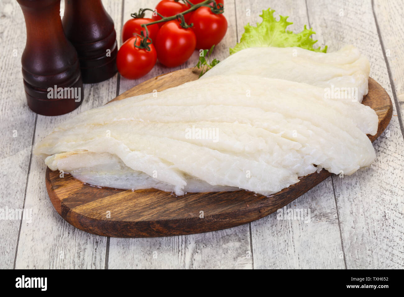 Raw halibut fillet ready for cooking Stock Photo Alamy