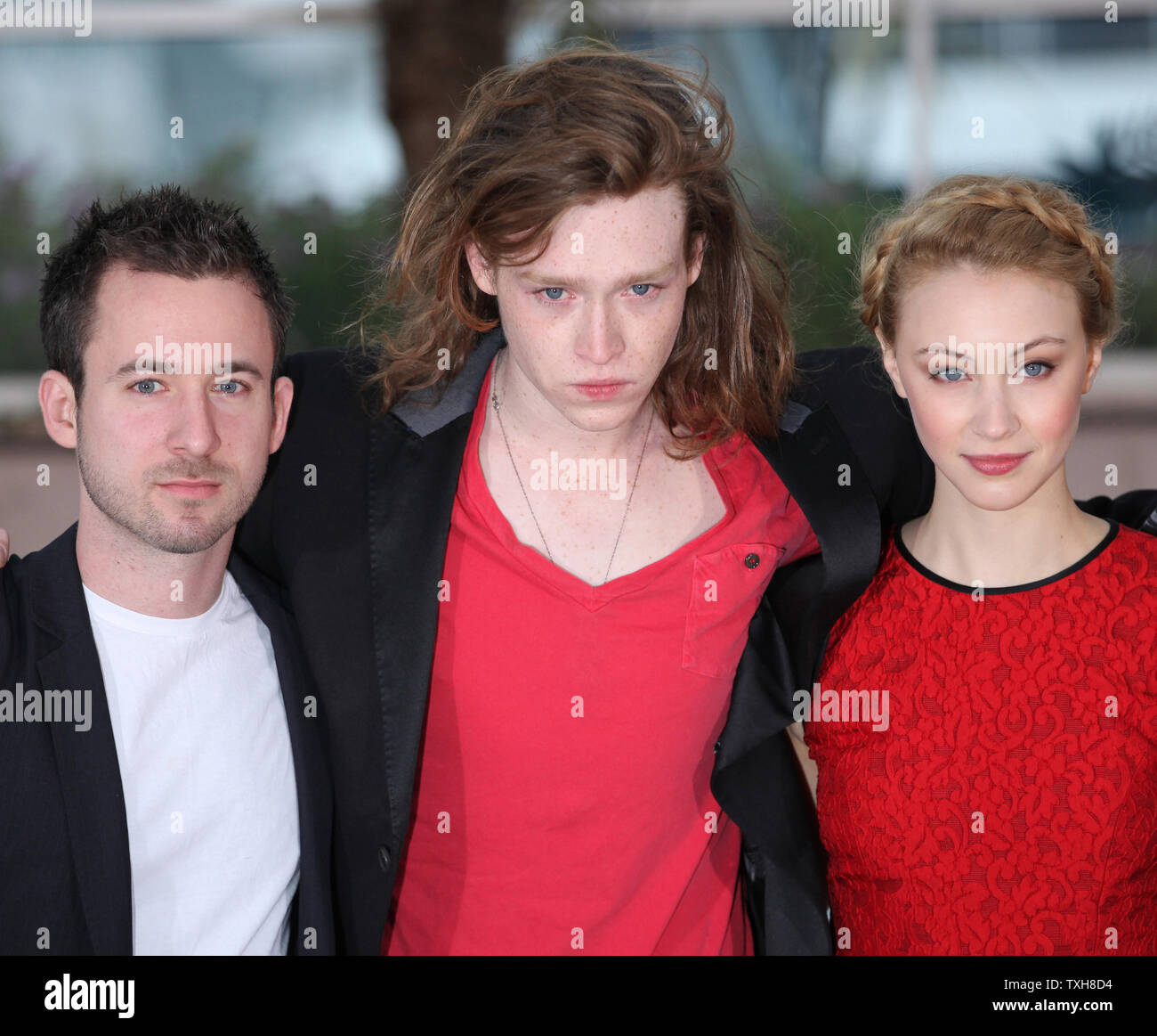Caleb Landry Jones (C) and Sarah Gadon arrive at a photocall for the