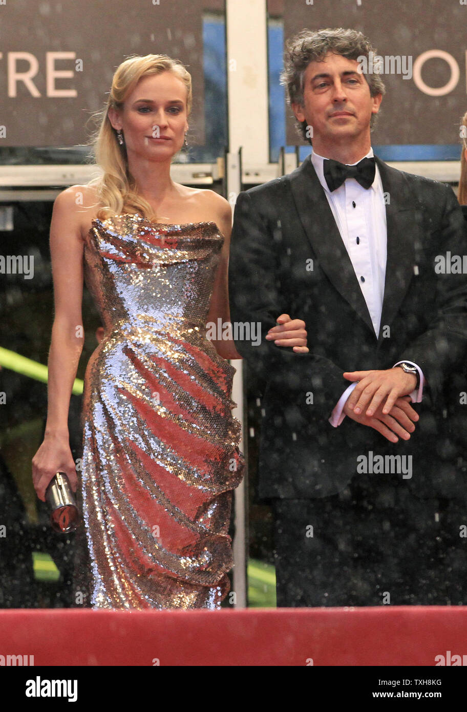 Jury members Diane Kruger (L) and Alexander Payne arrive at the top of the  red-carpeted steps of the Palais des Festivals before the screening of the  film "Amour" during the 65th annual