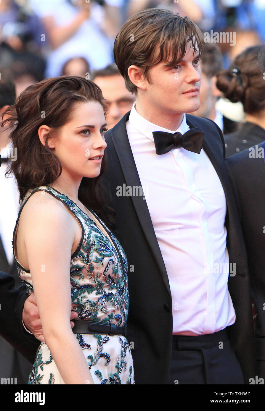 Kristen Stewart (L) and Sam Riley arrive on the red carpet before the screening of the film 'On The Road' during the 65th annual Cannes International Film Festival in Cannes, France on May 23, 2012.  UPI/David Silpa Stock Photo
