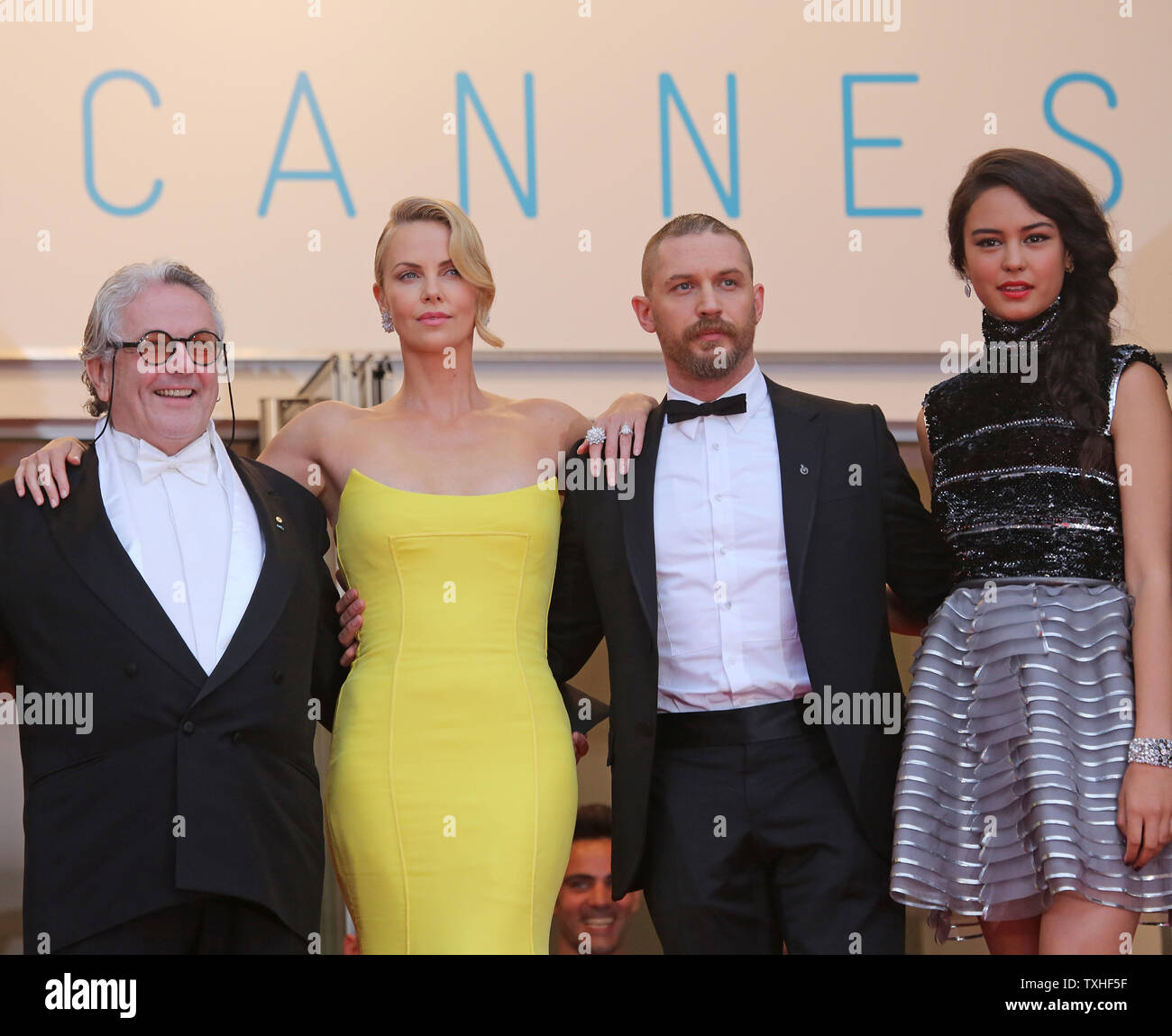 From L To R George Miller Charlize Theron Tom Hardy And Courtney Eaton Arrive On The Steps Of The Palais Des Festivals Before The Screening Of The Film Mad Max Fury From L To R George Miller Charlize Theron Tom Hardy And Courtney Eaton Arrive On The Steps Of The Palais Des Festivals Before The Screening Of The Film Mad Max Fury