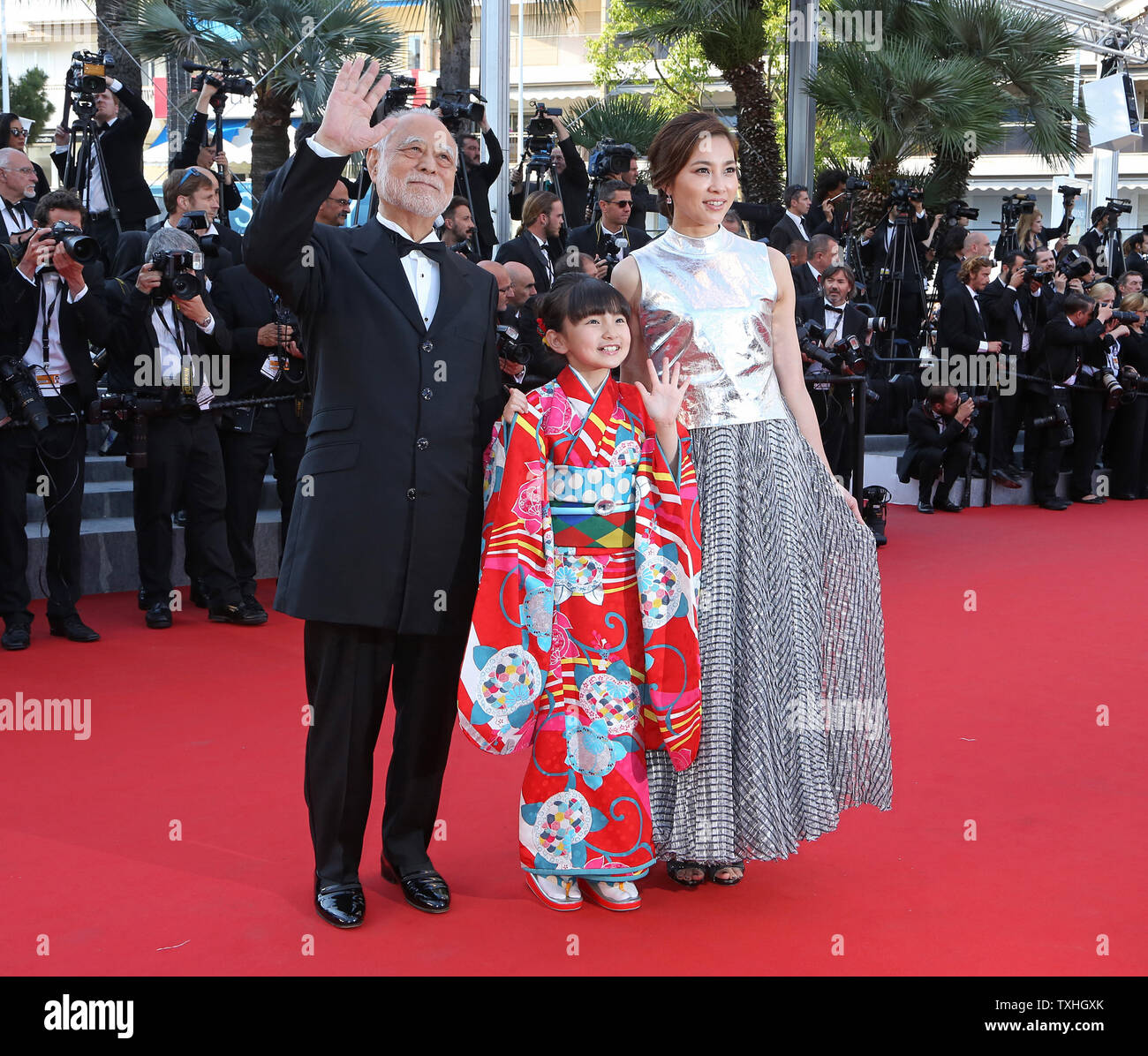 Masahiko Tsugawa (L), Rio Suzuki (C) and Asaka Seto arrive on the red carpet before the screening of the film 'The Little Prince' during the 68th annual Cannes International Film Festival in Cannes, France on May 22, 2015.  Photo by David Silpa/UPI Stock Photo