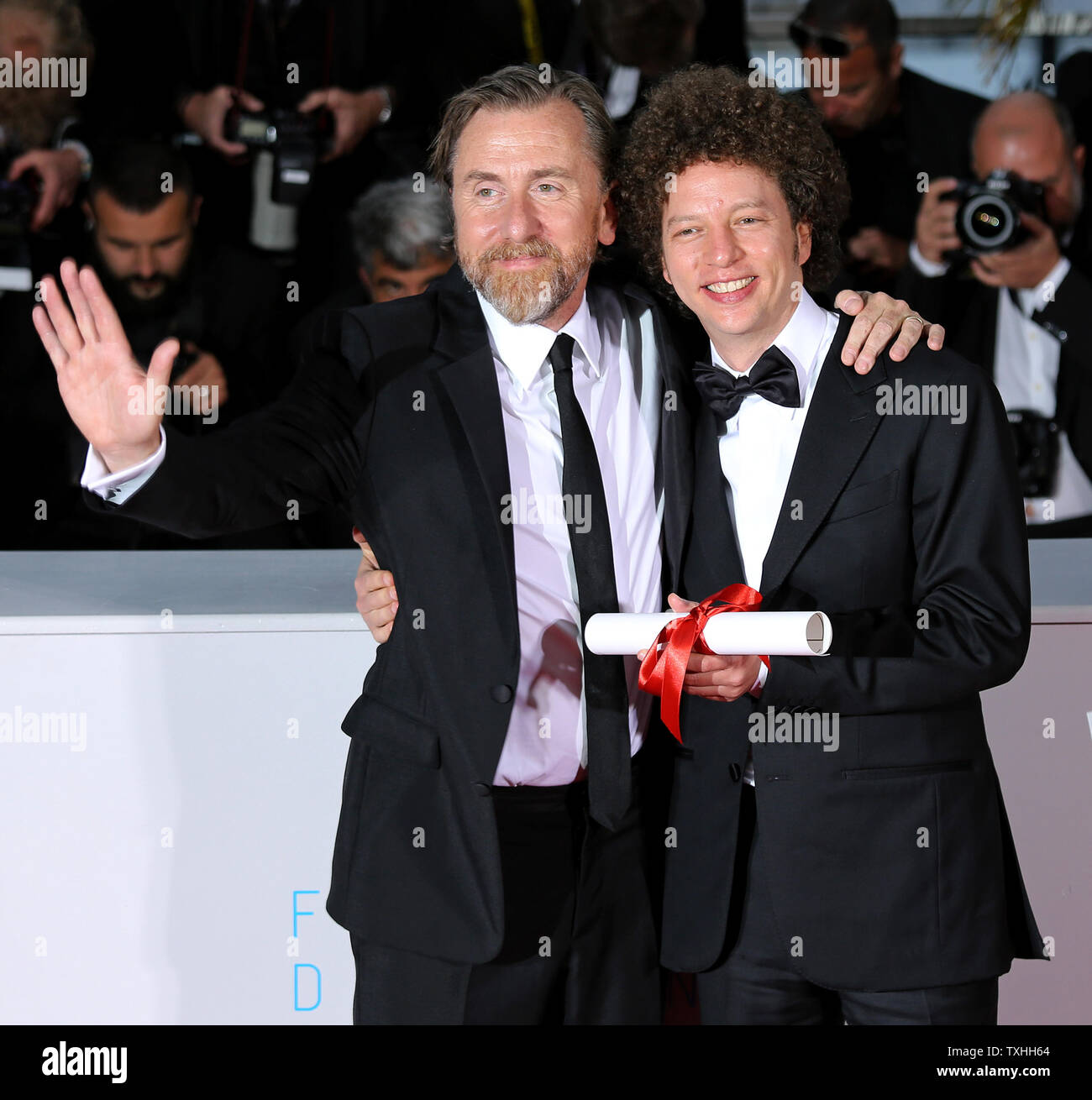 Tim Roth (L) and Michel Franco arrive at the award photo call after Franco received the "Best Screenplay" prize for the film "Chronic" during the 68th annual Cannes International Film Festival in Cannes, France on May 24, 2015.   Photo by David Silpa/UPI Stock Photo