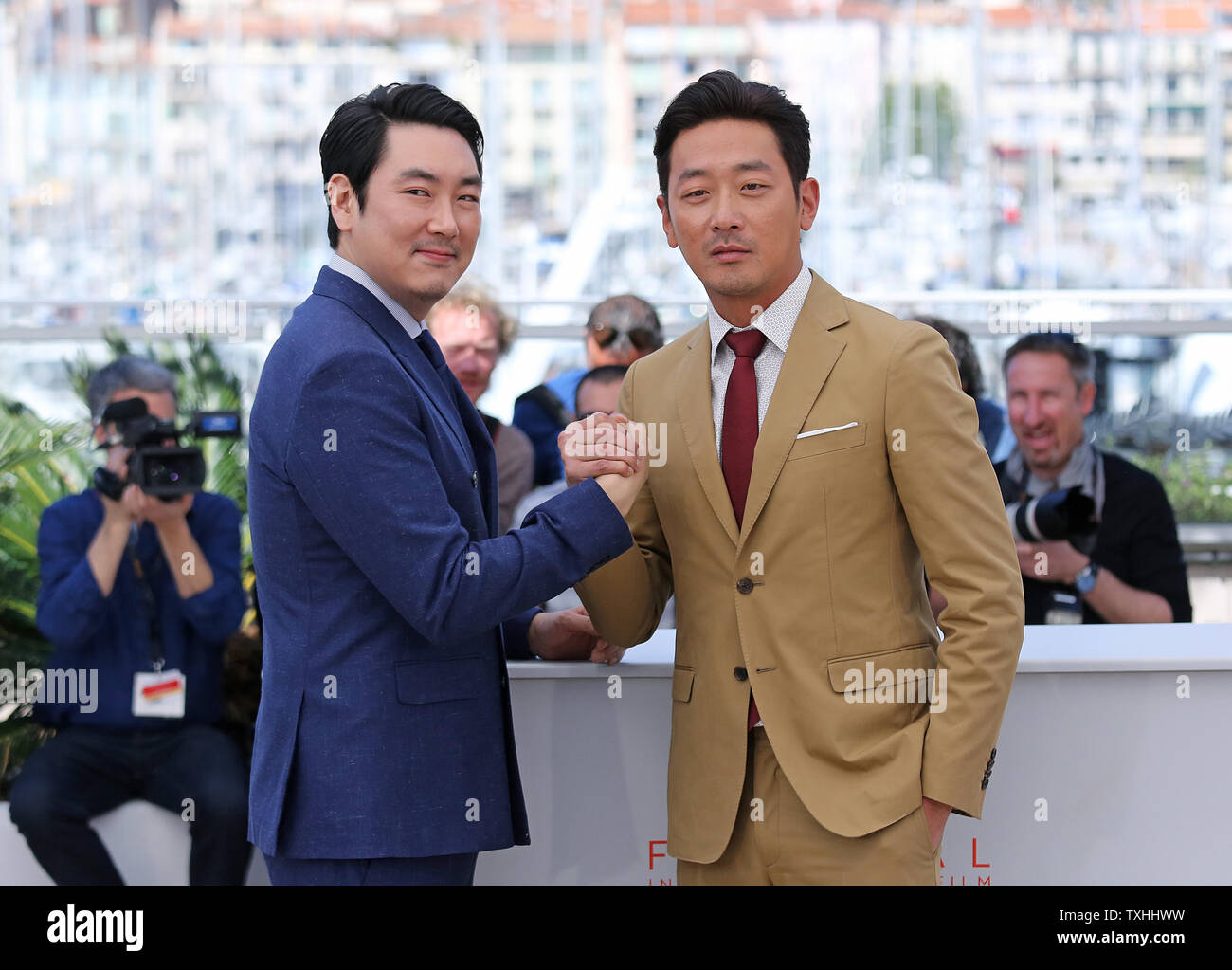 Cho Jin-Woong (L) and Ha Jung-Woo arrive at a photocall for the film 'Mademoiselle (Agassi, The Handmaiden)' during the 69th annual Cannes International Film Festival in Cannes, France on May 14, 2016.   Photo by David Silpa/UPI Stock Photo