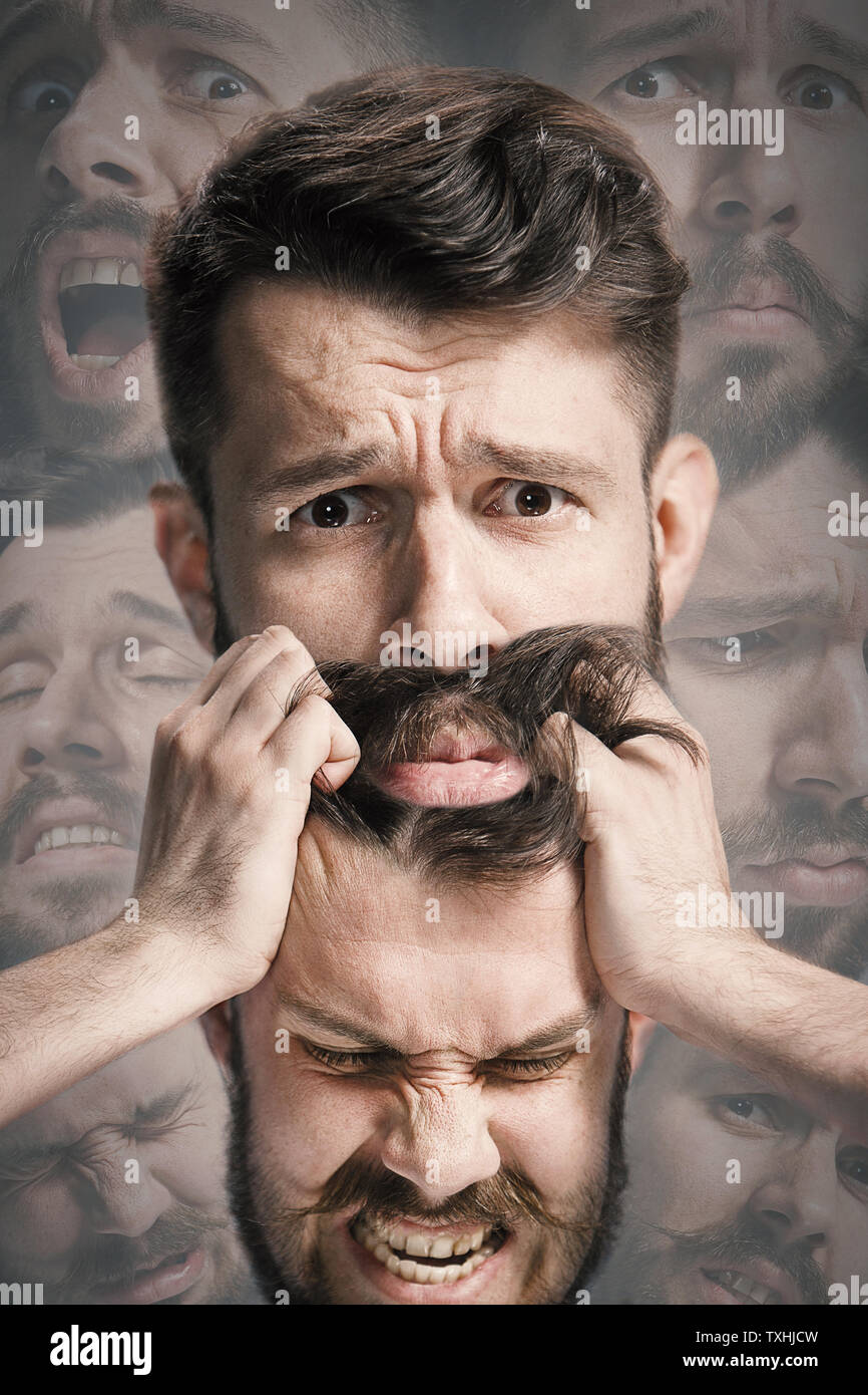 Close up shot of sad and angry emotion on face of discouraged man. Young caucasian male model angrying, scratching, screaming while holding his head. Mental health problems, troubles. Creative collage. Stock Photo