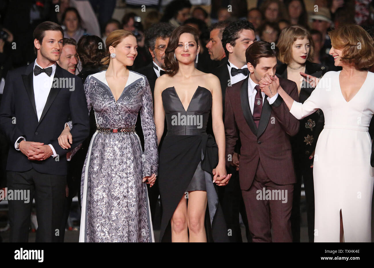 Gaspard Ulliel (L) and Lea Seydoux arrive on the red carpet before