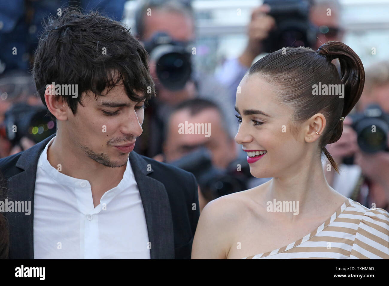 Devon Bostick (L) and Lily Collins arrive at a photocall for the film 'Okja' during the 70th annual Cannes International Film Festival in Cannes, France on May 19, 2017.  Photo by David Silpa/UPI Stock Photo