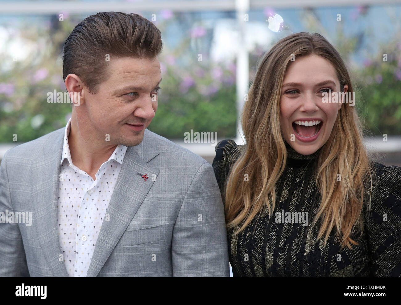 jeremy-renner-l-and-elizabeth-olsen-arrive-at-a-photocall-for-the
