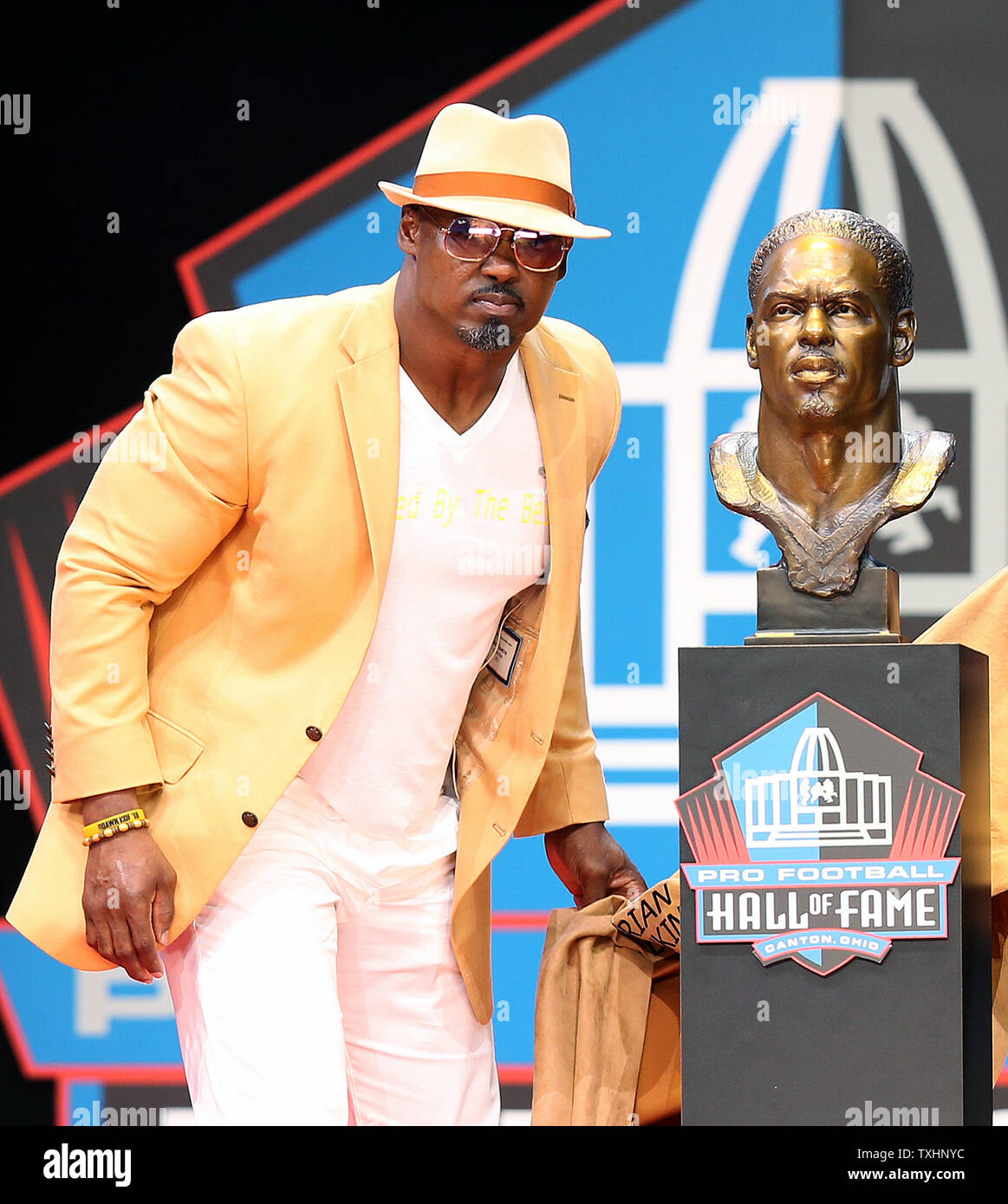 Former Philadelphia Eagles player Brian Dawkins poses by his bust during his enshrinement into the Pro Football Hall of Fame at Tom Benson Hall of Fame Stadium in Canton OH August 4, 2018. Photo by Aaron Josefczyk/UPI Stock Photo