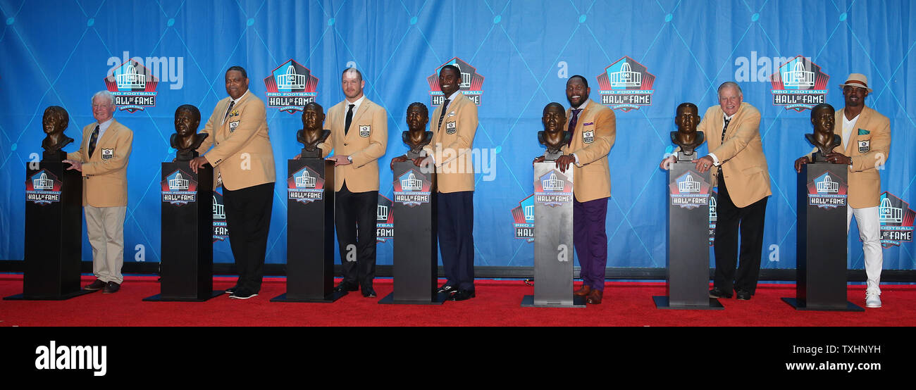 The 2018 Pro Football Hall of Fame inductees pose with their busts, (L-R) Bobby Beathard, Robert Brazile, Brian Urlacher, Randy Moss, Ray Lewis, Jerry Kramer and Brian Dawkins at Tom Benson Hall of Fame Stadium in Canton OH August 4, 2018. Terrell Owens was not present.  Photo by Aaron Josefczyk/UPI Stock Photo