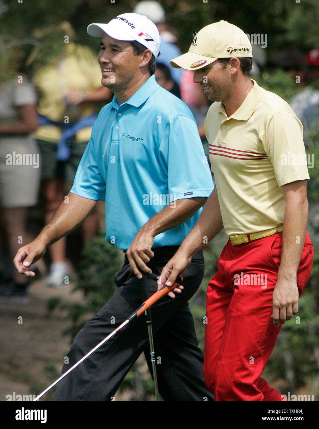 Winner Dean Wilson (L) walks up the 17th fairway with playing opponent Sergio Garcia during the final round of The International at Castle Pines Golf Club in Castle Rock, Colorado August 13, 2006.  Dean Wilson won on the second playoff hole defeating Tom Lehman with a birdie.  Both Lehman and Wilson finished The International with 34 points in the modified Stableford scoring system.   (UPI Photo/Gary C. Caskey) Stock Photo
