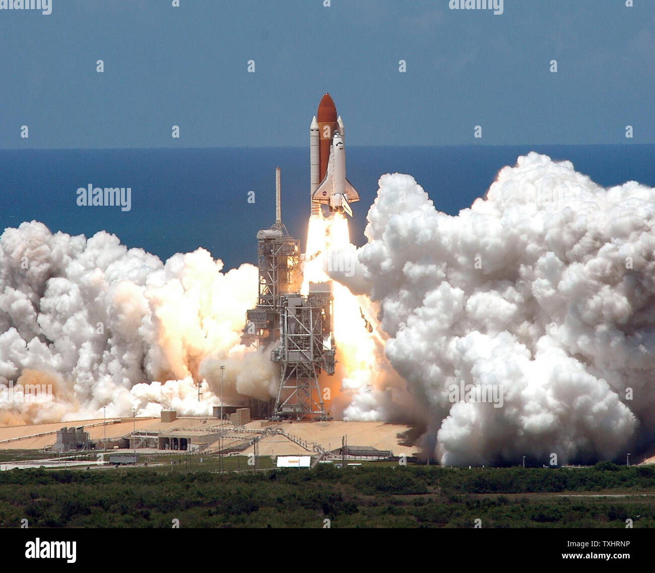 The Space Shuttle Discovery lifts off from Kennedy Space Center for ...