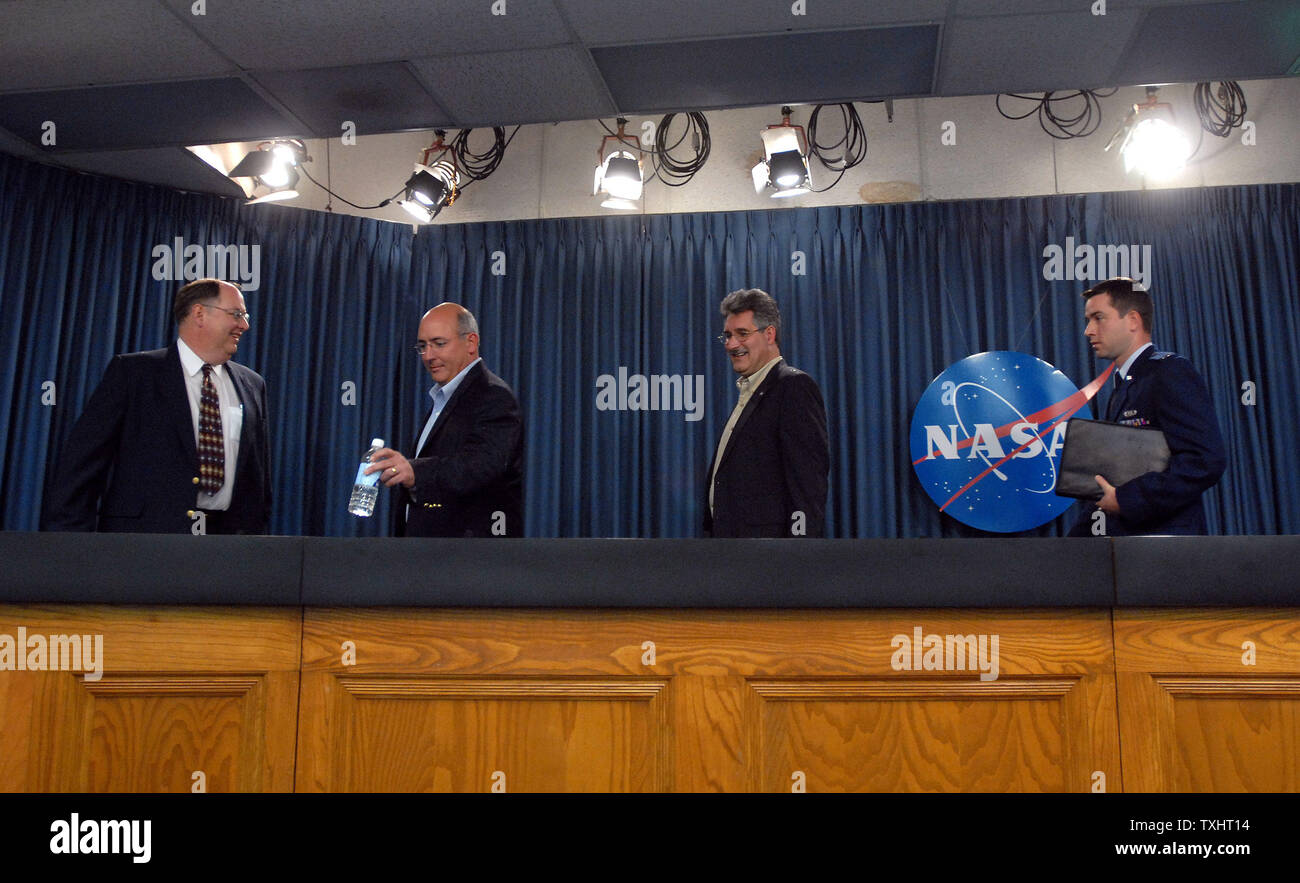 Shuttle Program Manager Wayne Hale, Steve Poulos, space shuttle orbiter project manager, Mike Suffredini, International Space Station manager, and U.S. Air Force 1st Lt. Kaleb Nordgren of the 4th Weather Squadron (L to R) arrive for a NASA briefing to discuss the planned launch attempt of Space Shuttle Atlantis at Kennedy Space Center in Florida on September 6, 2006. Atlantis, on mission STS-115, a construction mission to the International Space Station, is scheduled for launch on Friday, September 8, weather and mechanics permitting.    (UPI Photo/Roger L. Wollenberg) Stock Photo