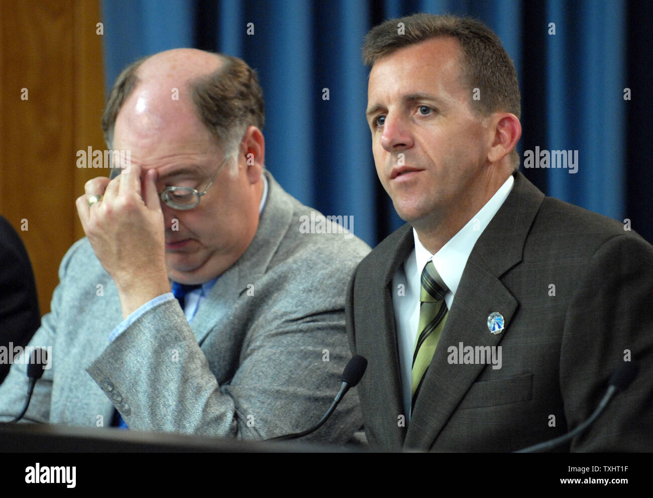 Shuttle Program Manager Wayne Hale  (L) and LeRoy Cain, chairman of the Mission Management Team, participates in a NASA briefing to discuss the problem with a fuel sensor which delayed the launch of Space Shuttle Atlantis at Kennedy Space Center in Florida on September 8, 2006. Atlantis' mission STS-115, a construction mission to the International Space Station, is delayed 24 hours while NASA considers the problem.    (UPI Photo/Roger L. Wollenberg) Stock Photo