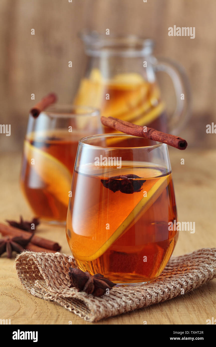Apple cider cocktail with cinnamon and apple slices. Stock Photo