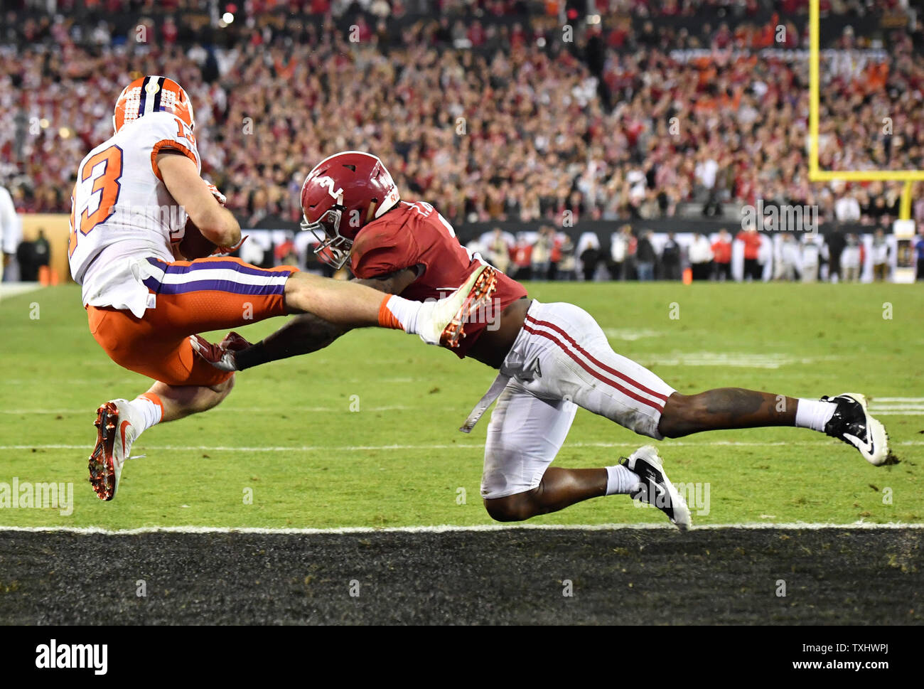 Clemson Tigers Wide Receiver Hunter Renfrow 13 Brings In The Game Winning Touchdown Against Alabama Crimson Tide Defensive Back Tony Brown 2 In The Fourth Quarter Of The 17 College Football Playoff