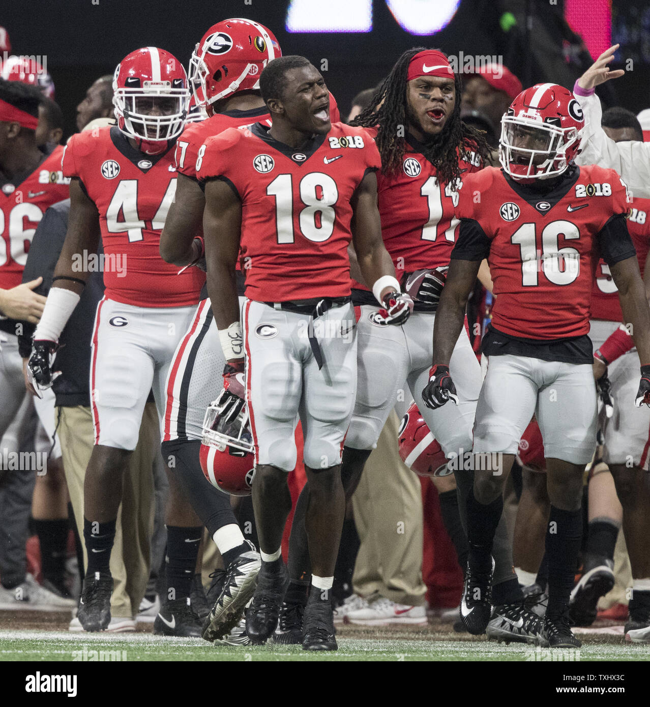 Georgia Bulldogs defensive back Deandre Baker (18) gegs flagged for  excessive celebration after intercepting an Alabama pass in the third  quarter of the NCAA College Football Playoff National Championship at  Mercedes-Benz Stadium