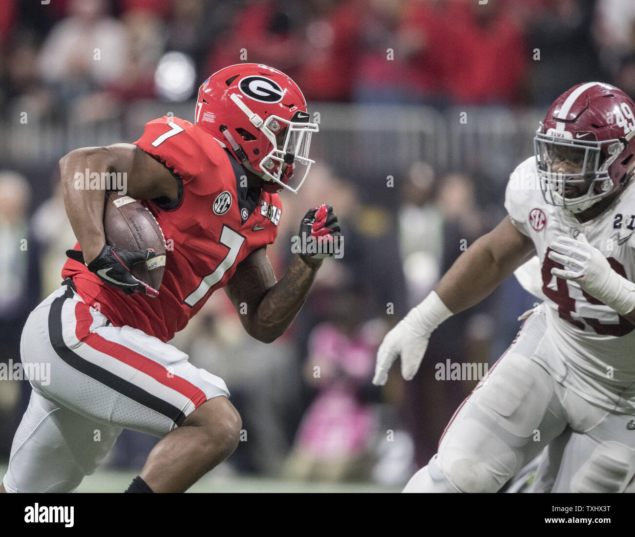 D'Andre Swift Georgia Bulldogs Unsigned Red Jersey Running Photograph