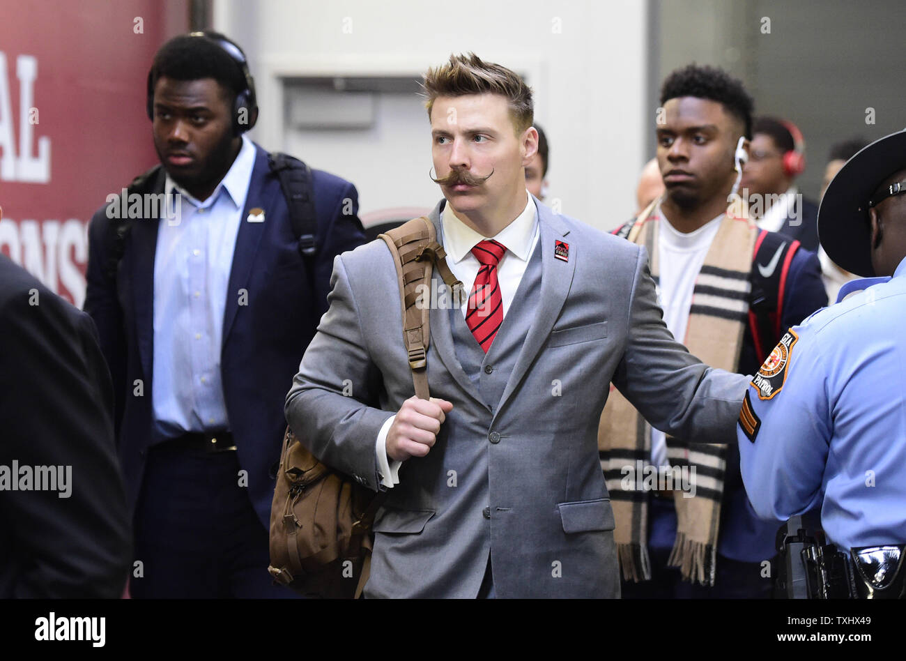 Georgia Bulldogs coach Aaron Feld (C) arrives for the NCAA College Football  Playoff National Championship against