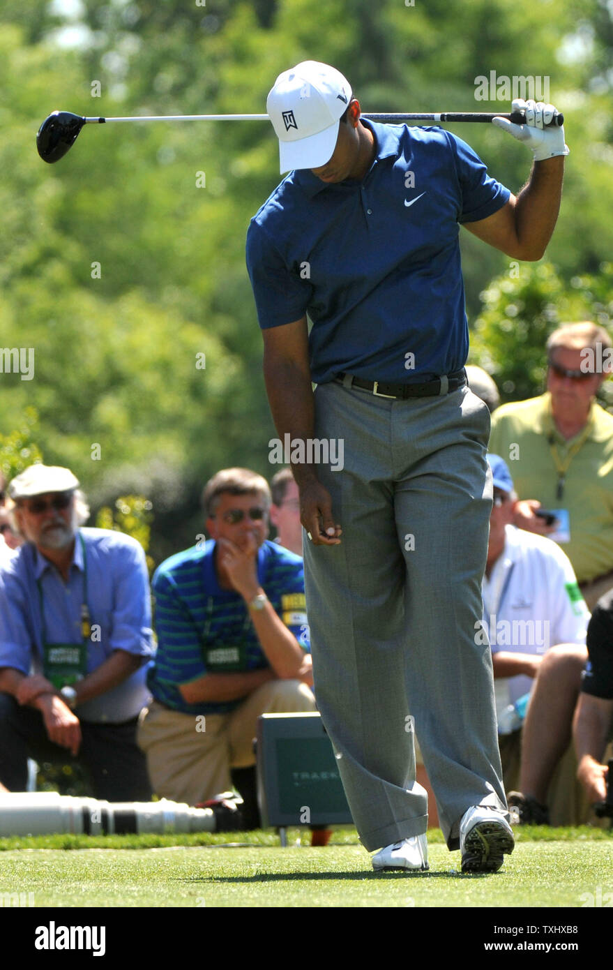 Tiger Woods reacts after hitting off of the 9th tee box during the