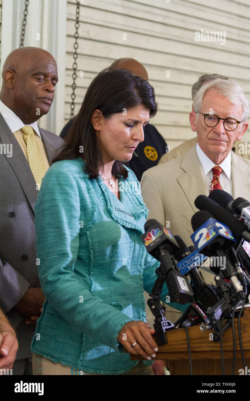 Governor Nikki Haley along with Charleston Mayor Joe Riley chokes back emotions as she discusses the mass killing and capture of the suspect who alledgedly murdered nine people at historic Mother Emanuel African Methodist Episcopal Church in Charleston, South Carolina on June 18, 2015.  Photo by Gillian Ellis/UPI Stock Photo