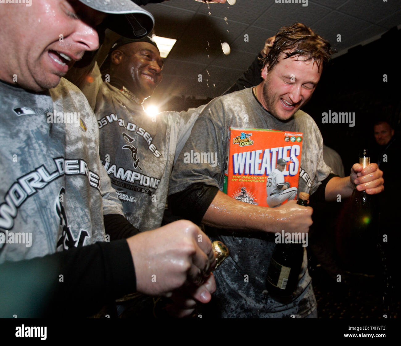 Chicago White Sox pitchers Cliff Politte, from left, Jose Contreras and Mark Buehrle celebrate their 1-0 over the Houston Astros in game 4 of the World Series, October 26, 2005 in Houston, TX. The White Sox won the World Series sweeping the Astros.  (UPI Photo/Brian Kersey) Stock Photo