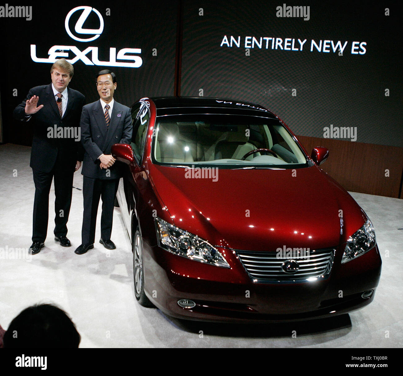 Lexus Group Vice President and General Manager Bob Carter, left, and Lexus Chief Engineer Hiroyuki Hirata unveil the Lexus ES 350 at the 2006 Chicago Auto Show on February 8, 2006 at McCormick Place in Chicago. (UPI Photo/Brian Kersey) Stock Photo