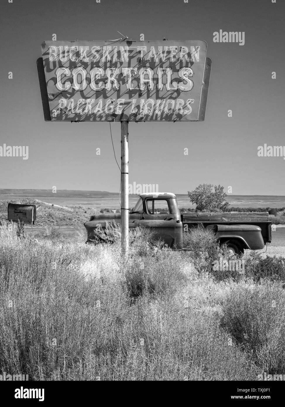 Old Chevrolet pick up truck parked in lot of a liquor store on the Arizona /Utah state line USA Stock Photo
