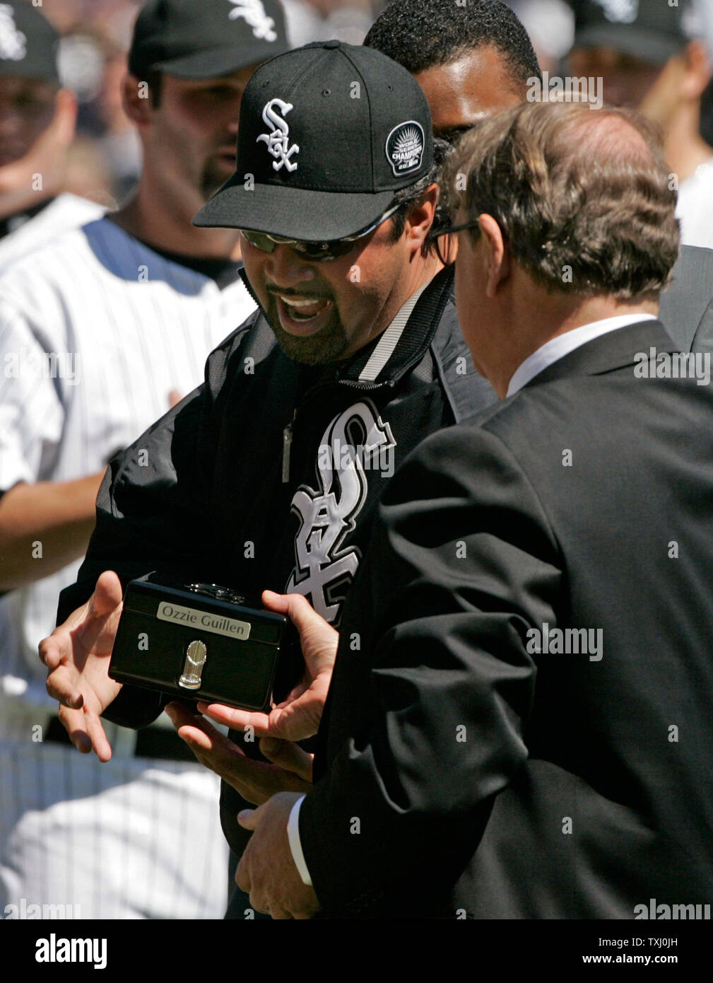 Chicago White Sox manager Ozzie Guillen, left, gets his 2005 World Series  Championship ring from chairman Jerry Reinsdorf before the game against the  Cleveland Indians on April 4, 2006, in Chicago. (UPI