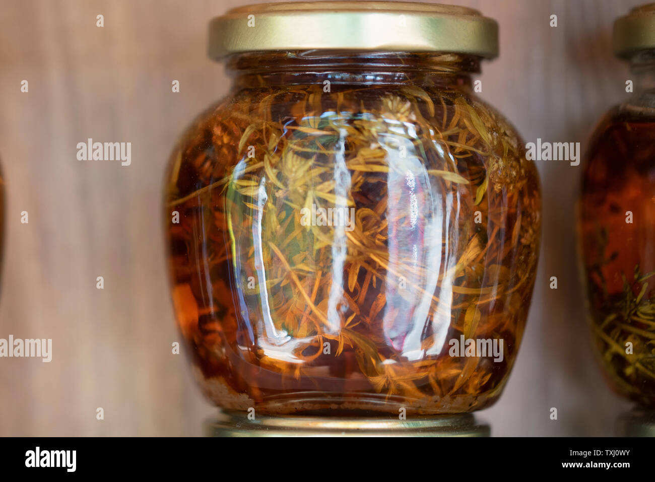 Jar with honey and natural herbs for sale on shelf Stock Photo Alamy