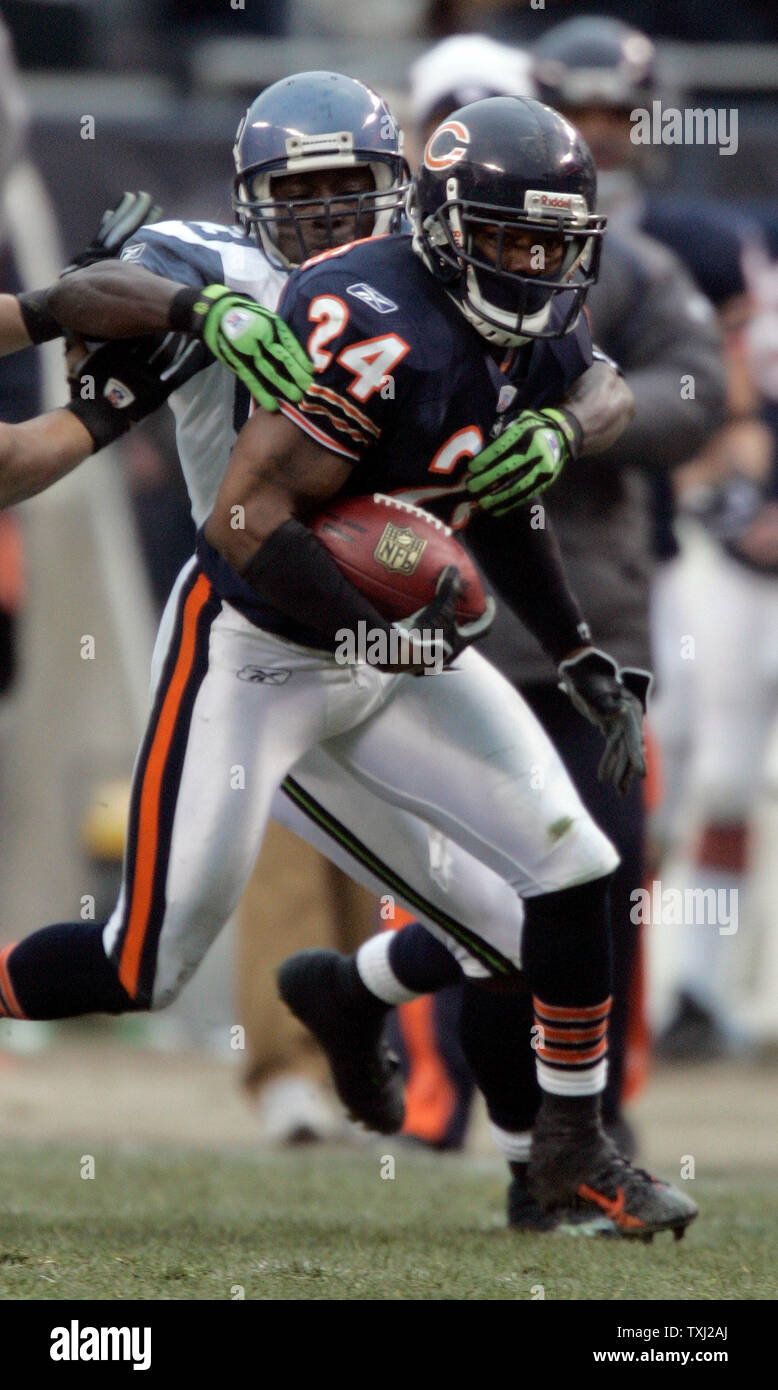 Chicago Bears Cornerback Ricky Manning Jr 24 Is Tackled By Seattle Seahawks Wide Receiver Deion Branch After Intercepting A Pass In Their Nfc Divisional Play Off Game At Soldier Field In Chicago