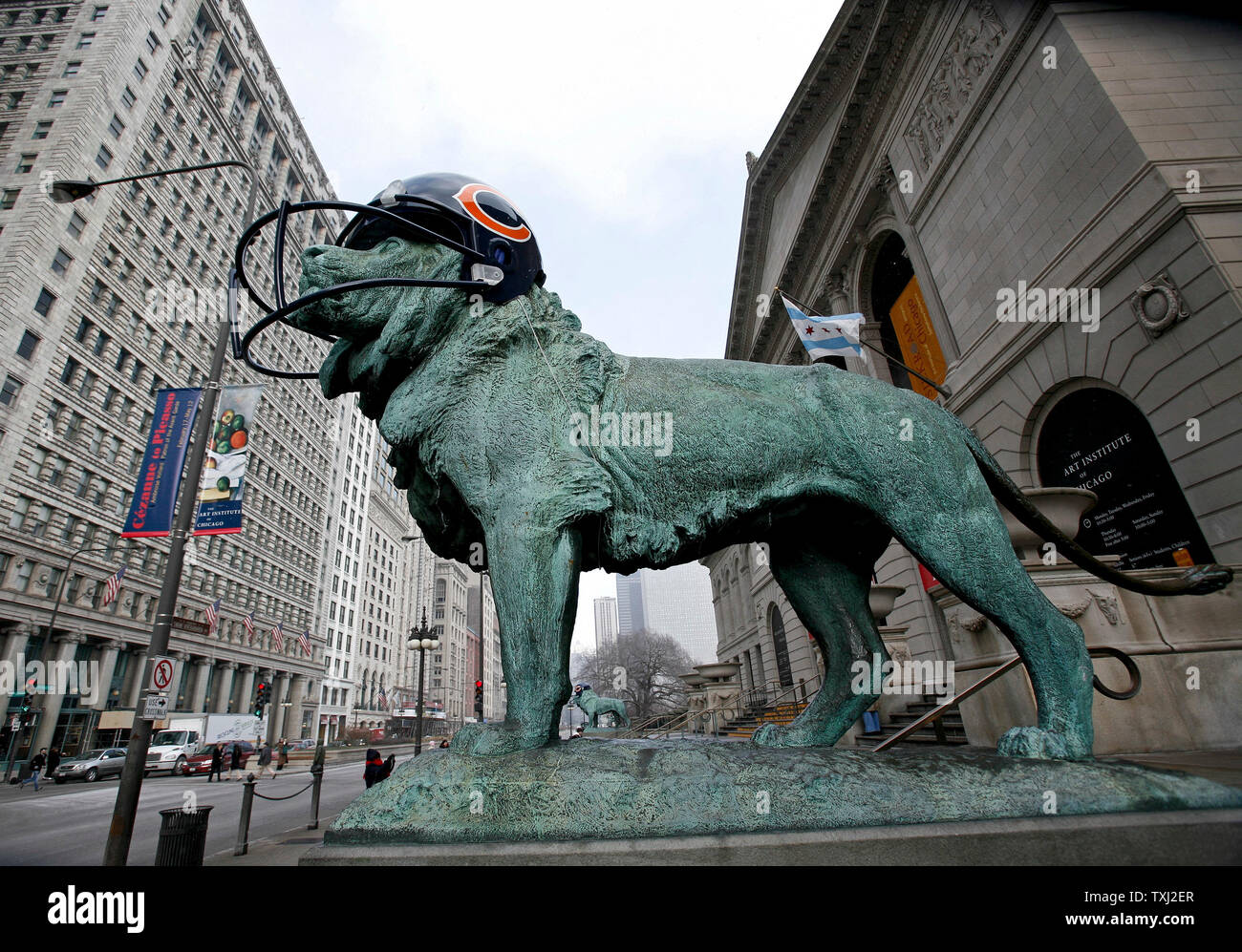 One of the two bronze lions wears a fiberglass Chicago Bears helmet at The Art Institute of Chicago on February 2, 2007, in Chicago. The lions were fitted with fiberglass helmets to celebrate the Bears winning season. The Bears play the Indianapolis Colts in Super Bowl XLI on Sunday. (UPI Photo/Brian Kersey) Stock Photo